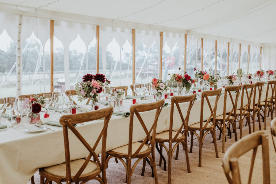 Cross-back chairs and tablecloths and indian windows